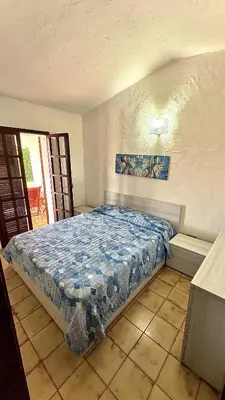 Letto o letti in una camera di Villa Franziscu