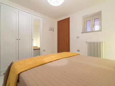 Letto o letti in una camera di Villa il Carrubo