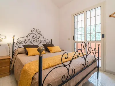 Letto o letti in una camera di Villa il Carrubo