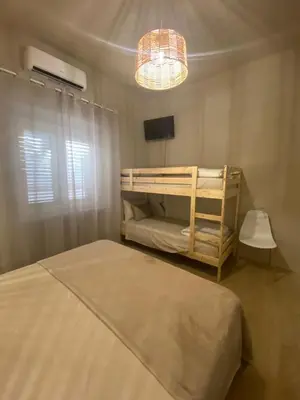 Letto o letti in una camera di DreamHouse B&B Olbia