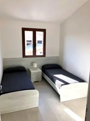 Letto o letti in una camera di La perla sul mare della Caletta