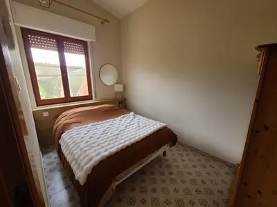 Letto o letti in una camera di maison capo comino