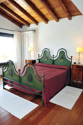 Letto o letti in una camera di Villa Geron