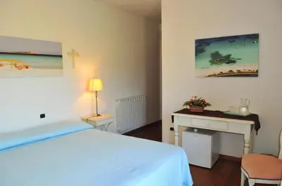 Letto o letti in una camera di Villa Geron