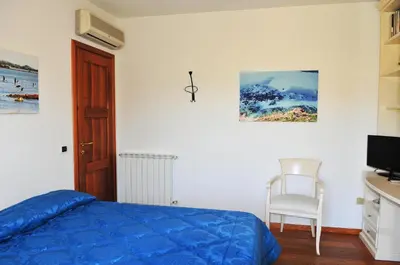 Letto o letti in una camera di Villa Geron