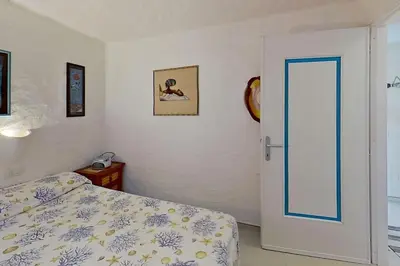 Letto o letti in una camera di Nautilus, In front of Tavolara Island