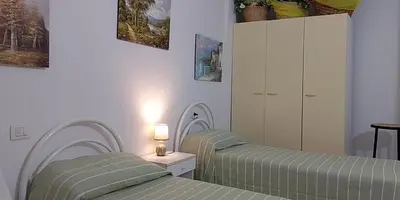 Letto o letti in una camera di Casa Marconi