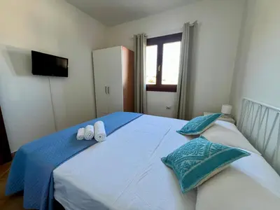 Letto o letti in una camera di Villa Sunrise