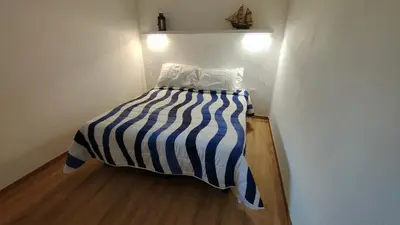 Letto o letti in una camera di APPARTAMENTO San TEODORO