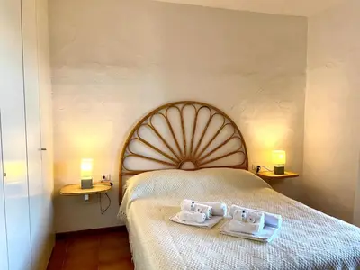 Letto o letti in una camera di San Teodoro PUNTA EST Bilocale VISTA MARE