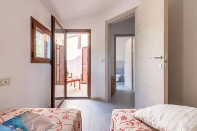 Letto o letti in una camera di Casa Marco Sardinia Domus
