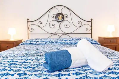 Letto o letti in una camera di Palm Garden House - Cala Gonone