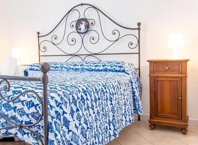 Letto o letti in una camera di Palm Garden House - Cala Gonone