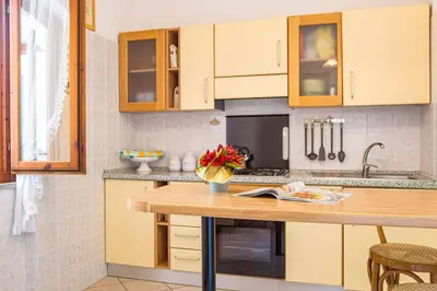 Cucina o angolo cottura di Palm Garden House - Cala Gonone