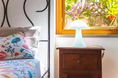 Letto o letti in una camera di Palm Garden House - Cala Gonone