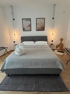 Letto o letti in una camera di San Simplicio Relax Apartment