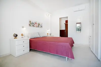 Letto o letti in una camera di AMBRA Holiday Rooms - Rooms & Beach