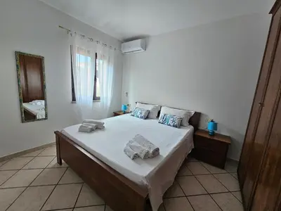 Letto o letti in una camera di Budoni Case Vacanze