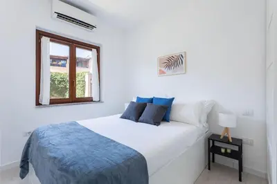 Letto o letti in una camera di Olbia Marina - Near Airport with SwimmingPool