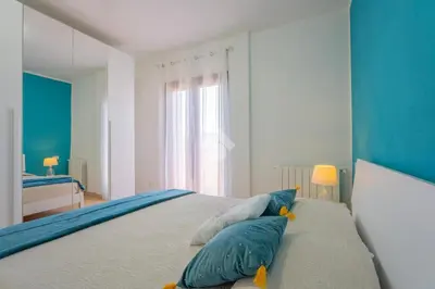 Letto o letti in una camera di L'attico di Loredo
