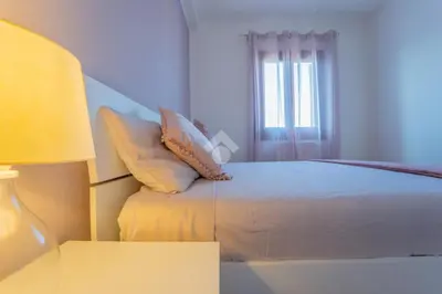 Letto o letti in una camera di L'attico di Loredo