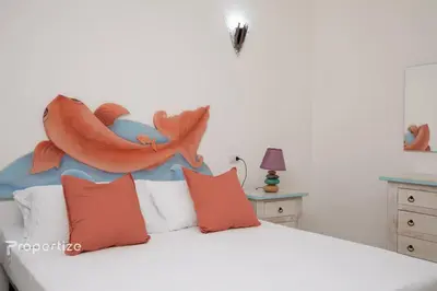 Letto o letti in una camera di Villa Azzurra by Propertize