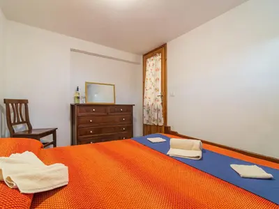 Letto o letti in una camera di Casa a 150 m Dalla Spiaggia