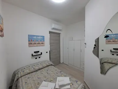 Letto o letti in una camera di Maristella