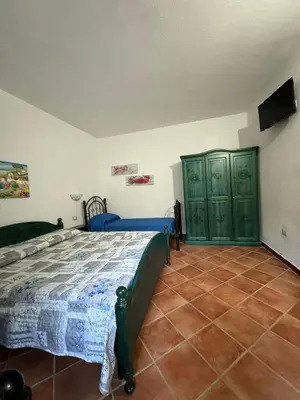 Letto o letti in una camera di B&B Il Glicine