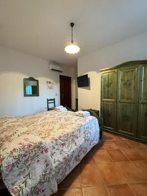 Letto o letti in una camera di B&B Il Glicine