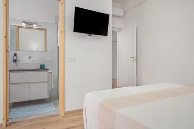 Letto o letti in una camera di Nott'e Die
