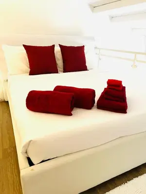 Letto o letti in una camera di Loft Porto Romano Olbia Centro