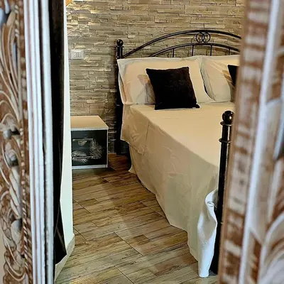 Letto o letti in una camera di Giojas - Camera quadrupla in centro