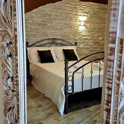 Letto o letti in una camera di Giojas - Camera quadrupla in centro
