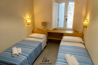 Letto o letti in una camera di Eden affittacamere