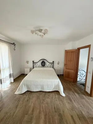 Letto o letti in una camera di Budoni Residence Lutturai 1