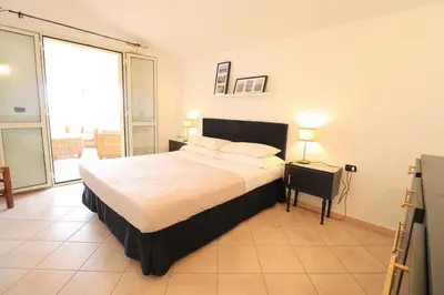 Letto o letti in una camera di Sardegna Appartamento panoramico cod IUN Q4795
