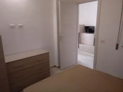Letto o letti in una camera di Appartamento Su Survaju