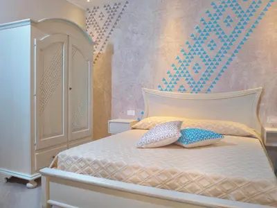 Letto o letti in una camera di Sa Pintadera