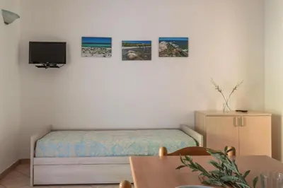 TV o dispositivi per l'intrattenimento presso Simple Gem of Le Dimore di Budoni 1 Bedroom B4 Apartment sleeps 4