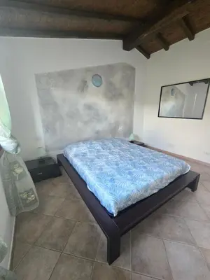 Letto o letti in una camera di Trilocale Climatizzato L'OLEANDRO Tanaunella