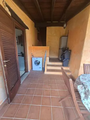 Area soggiorno di Trilocale Climatizzato L'OLEANDRO Tanaunella