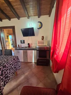 Cucina o angolo cottura di Trilocale Climatizzato L'OLEANDRO Tanaunella
