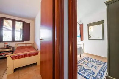 Letto o letti in una camera di Al mare a Capo Comino