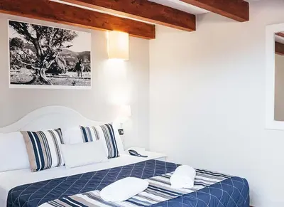 Letto o letti in una camera di Zeta Club San Teodoro Le Rose