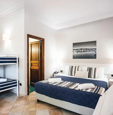 Letto o letti in una camera di Zeta Club San Teodoro Le Rose