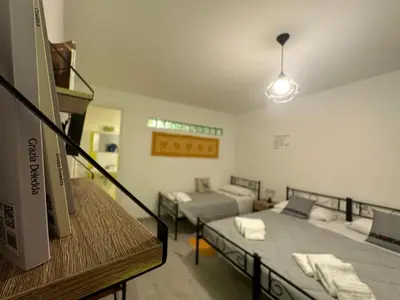 Letto o letti in una camera di Il Rifugio delle parole