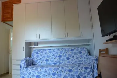 Letto o letti in una camera di FPO-FIO06PT delizioso bilocale 4 pax con veranda