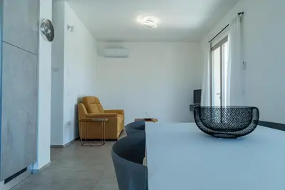 Area soggiorno di Le Conchiglie Apartments with Pool by Wonderful Italy