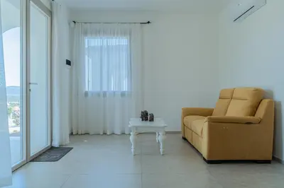 Area soggiorno di Le Conchiglie Apartments with Pool by Wonderful Italy